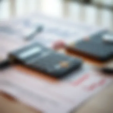 A calculator and financial documents on a table